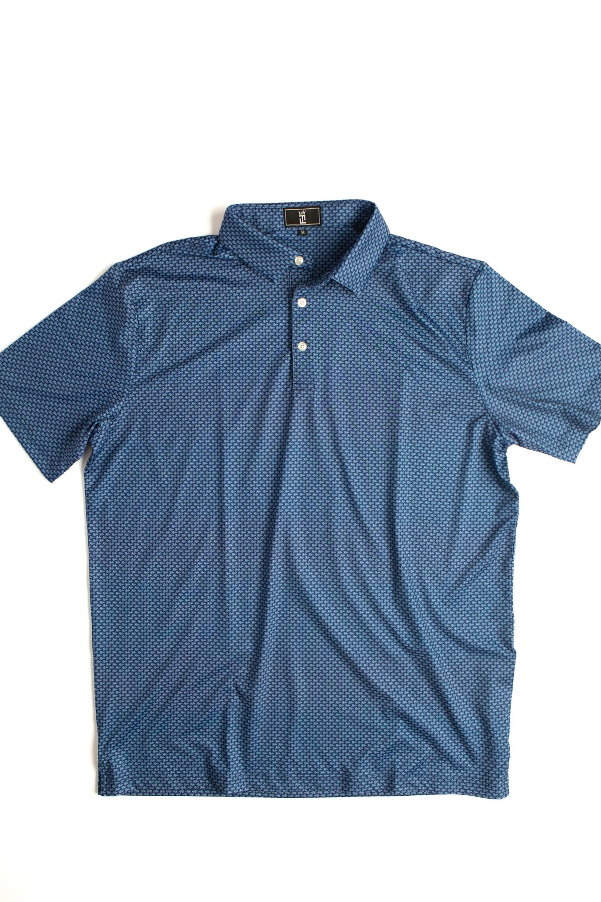 Navy Script polo by Fore Horsemen, flat lay